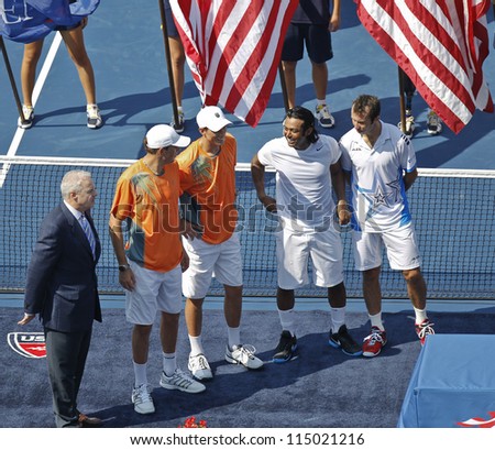 NEW YORK - SEPTEMBER 07: Bob & Mike Bryan of USA & Leander Paes of India & Radek Stepanek of Czech Republic at trophy presentation for men double at US Open tennis tournament on Sep 7, 2012 in NYC