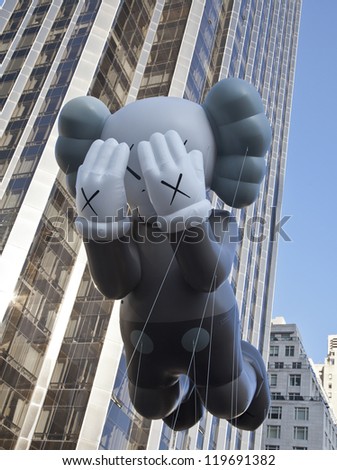 NEW YORK - NOVEMBER 22: KAWS Copmanion balloon is flown at the 86th Annual Macy\'s Thanksgiving Day Parade on November 22, 2012 in New York City.