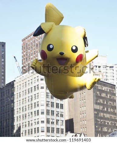 NEW YORK - NOVEMBER 22: Pokemon balloon is flown at the 86th Annual Macy\'s Thanksgiving Day Parade on November 22, 2012 in New York City.