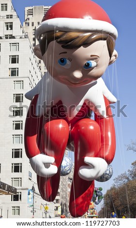 NEW YORK - NOVEMBER 22: Elf on the Shelf balloon is flown at the 86th Annual Macy\'s Thanksgiving Day Parade on November 22, 2012 in New York City.