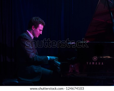NEW YORK - JANUARY 11: Ehud Asherie piano performs with Catherine Russell band on stage as part of NYC Winter Jazz Festival at Le Poisson Rouge on January 11, 2013 in New York City