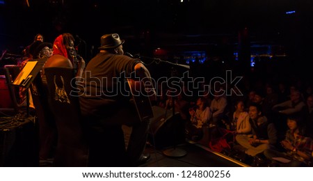 NEW YORK - JANUARY 12: Audience listens Celebrate Great Women of Blues and Jazz band preforms on stage as part of NYC Winter Jazz Festival at Le Poisson Rouge on January 12, 2013 in New York City