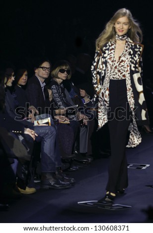 NEW YORK - FEBRUARY 10: Model walks runway as Anna Wintour watches at Fall 2013 presentation for Diane Von Furstenberg collection at Mercedes-Benz Fashion Week at Lincoln Center on Feb 10, 2013 in NYC