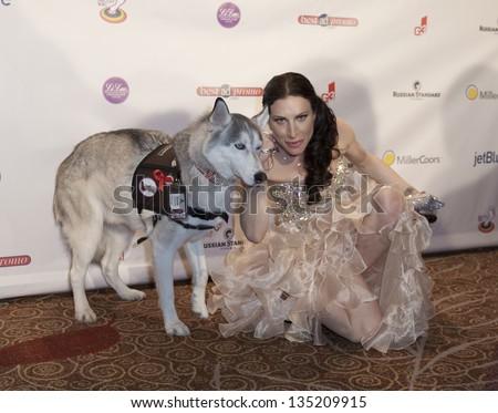 NEW YORK - APRIL 06: Caroline Loevner and dog attend the 27th Annual Night Of A Thousand Gowns at the Hilton New York on April 6, 2013 in New York City