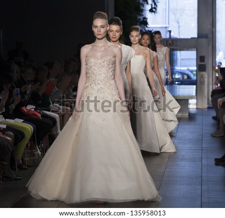 NEW YORK - APRIL 21: Models walk runway for Rivini collection by Rita Vinieris during Bridal week in The David Rubenstein Atrium at Lincoln Center on April 21, 2013 in New York City