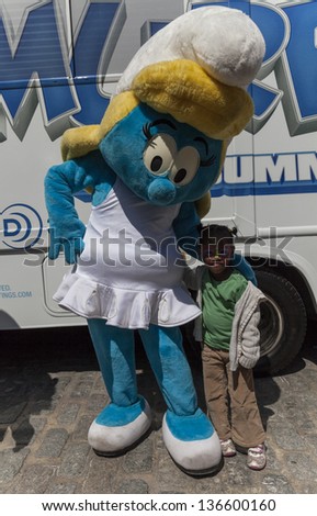 NEW YORK - APRIL 27: Smurf character Smurfette from Smurfs 2 movie attends at Family festival during the 2013 Tribeca Film festival on Greenwich street on April 27, 2013 in New York City