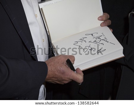 NEW YORK - MAY 14: Eric Fischl autographs his book at Eric Fischl\'s \'Bad Boy\' Book Launch Celebration at Mary Boone Gallery on Fifth Avenue on May 14, 2013 in New York City.