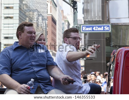 NEW YORK - JULY 16: Baseball player Atlanta Braves first baseman Freddie Freeman waves to fans as he passes by during the MLB All-Star Game Red Carpet Show along 42nd street on July 16, 2013 in NYC