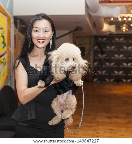 NEW YORK - AUGUST 11: Model walks dog on runway at Dog fashion show By Bandit-Rubio at Roger Smith Hotel on August 11, 2013 in New York City