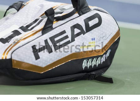 NEW YORK - SEPTEMBER 5: Novak Djokovic of Serbia tennis bag at quarterfinal match against Mikhail Youzhny of Russia  at USTA Billie Jean King National Tennis Center on September 5, 2013 in New York
