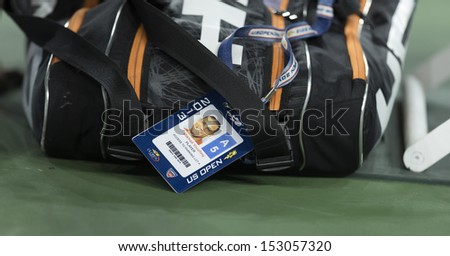 NEW YORK - SEPTEMBER 5: Mikhail Youzhny of Russia tennis bag at quarterfinal match against Novak Djokovic of Serbia at USTA Billie Jean King National Tennis Center on September 5, 2013 in New York