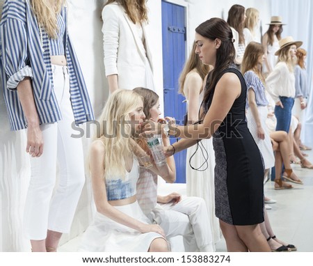 NEW YORK - SEPTEMBER 11: Exhausted models show off dresses during Spring/Summer 2014 Fashion week for JOIE collection by Serge Azria at 548 Center on September 11, 2013 in New York City