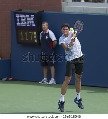 NEW YORK - AUGUST 31: Milos Raonic of Canada returns ball during 3rd round match against Feliciano Lopez of Spain at 2013 US Open at USTA Billie Jean King Tennis Center on August 31, 2013 in New York