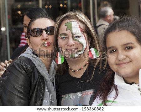 NEW YORK - OCTOBER 14: Revelers with painted lips, faces and eyes in Italian national colors attend during annual Columbus Day Parade on 5th Avenue on October 14, 2013 in New York City
