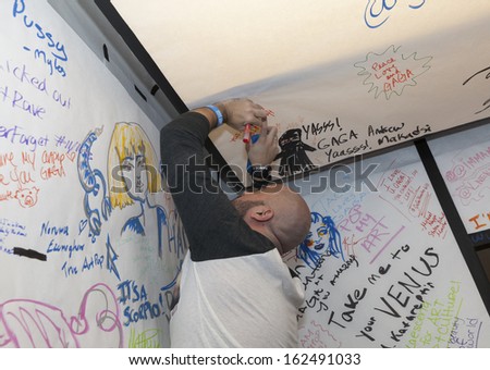 NEW YORK - NOVEMBER 11: Unidentified fan post message on message board during Artpop Pop Up: A Lady Gaga Gallery in Meatpacking District on November 11, 2013 in New York City