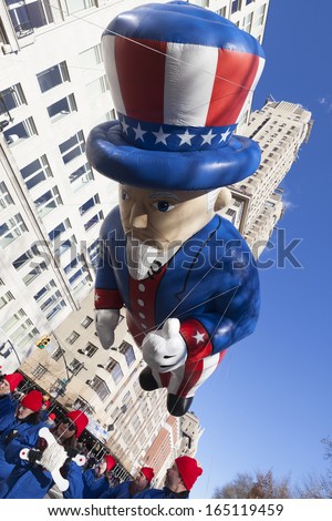 NEW YORK - NOVEMBER 28: Uncle Sam balloon is flown low because of weather condition at the 87th Annual Macy\'s Thanksgiving Day Parade on November 28, 2013 in New York City.