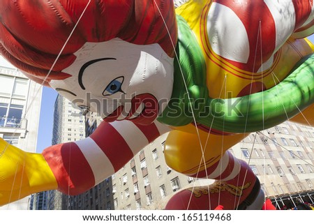 NEW YORK - NOVEMBER 28: Ronald McDonalds balloon is flown low because of weather condition at the 87th Annual Macy's Thanksgiving Day Parade on November 28, 2013 in New York City.