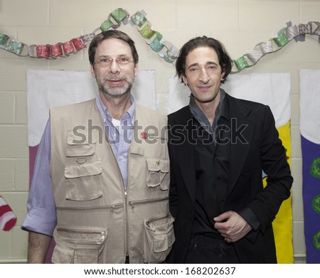 NEW YORK - DEC 20: Adrien Brody & Adam Keehn attend Action Center Post-Sandy Holiday Party at The Action Center presented by Bulgari & Save the Children on Dec 20, 2013 in Far Rockaway of Queens in NY