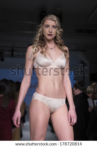 NEW YORK, NY - FEBRUARY 24, 2014: Model walks runway for Lingerie fashion night IN show by Anita during CurveExpo at Tribeca Skyline Studios