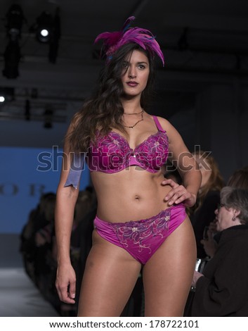 NEW YORK, NY - FEBRUARY 24, 2014: Model walks runway for Lingerie fashion night IN show by Curvy Couture during CurveExpo at Tribeca Skyline Studios
