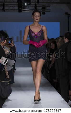 NEW YORK, NY - FEBRUARY 24, 2014: Model walks runway for Lingerie fashion night IN show by Aubade during CurveExpo at Tribeca Skyline Studios