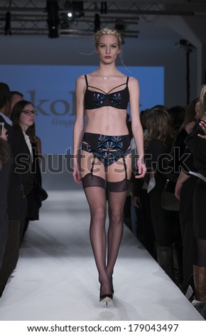 NEW YORK, NY - FEBRUARY 24, 2014: Model walks runway for Lingerie fashion night IN show by Sokoloff Lingerie during CurveExpo at Tribeca Skyline Studios