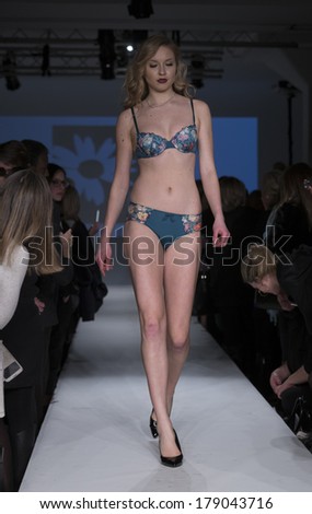 NEW YORK, NY - FEBRUARY 24, 2014: Model walks runway for Lingerie fashion night IN show by Luli Lingerie during CurveExpo at Tribeca Skyline Studios