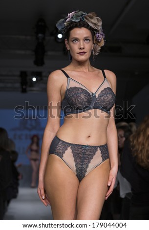 NEW YORK, NY - FEBRUARY 24, 2014: Model walks runway for Lingerie fashion night IN show by B.tempt\'d during CurveExpo at Tribeca Skyline Studios