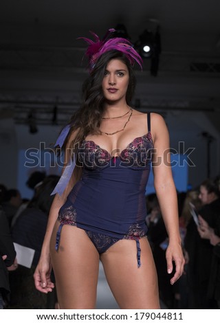 NEW YORK, NY - FEBRUARY 24, 2014: Model walks runway for Lingerie fashion night IN show by Panache during CurveExpo at Tribeca Skyline Studios
