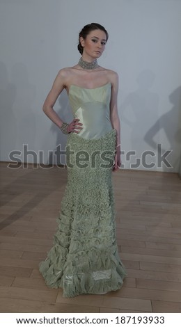 NEW YORK, NY - APRIL 13, 2014: Model shows off evening gown for Junko Yoshioka runway show during bridal week at Studio Arte on 37th Street
