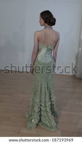 NEW YORK, NY - APRIL 13, 2014: Model shows off evening gown for Junko Yoshioka runway show during bridal week at Studio Arte on 37th Street