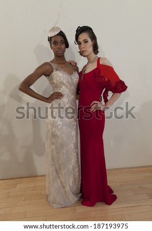 NEW YORK, NY - APRIL 13, 2014: Models show off evening gown for Junko Yoshioka runway show during bridal week at Studio Arte on 37th Street