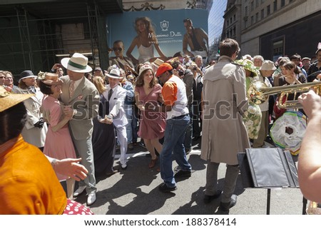 New York, USA - April 20, 2014: People dance at the Easter Bonnet Parade on 5th Avenue