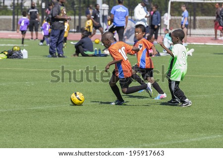 NEW YORK, NY - MAY 31, 2014: Bronx United Soccer boys soccer teams plays at Macombs Dam Field  the Bronx
