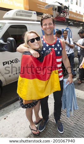 New York, NY USA - JUNE 26: Couple of the United States & Germany Men\'s National Soccer Team celebrate after both teams advanced to second round of World Cup outside of Legends Bar