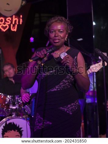 NEW YORK, NY - JUNE 30, 2014: Gail Marquis Olympic Silver medal winner speaks at Broadway Sings For Pride benefit concert at Toshi\'s Living Room at The Flatiron Hotel