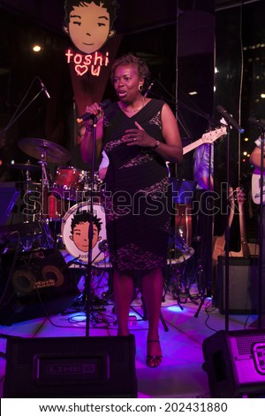 NEW YORK, NY - JUNE 30, 2014: Gail Marquis Olympic Silver medal winner speaks at Broadway Sings For Pride benefit concert at Toshi's Living Room at The Flatiron Hotel
