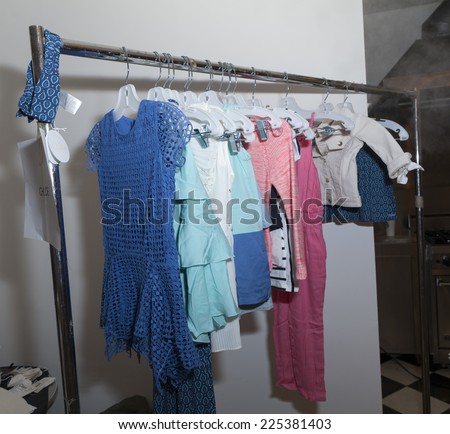 New York, NY - October 18, 2014: Dresses by Chloe on rack on display at backstage for PetiteParade Kids Fashion week at Bath House Studios