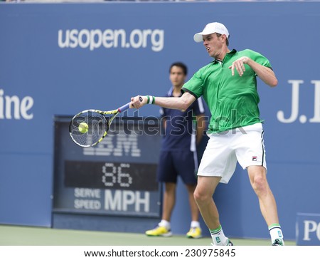 NEW YORK, NY - AUGUST 30, 2014: Sam Querrey of USA returns ball during 3rd round match against Novak Djokovic of Serbia at US Open tennis tournament in Flushing Meadows USTA Tennis Center