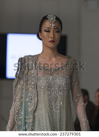 New York, NY - November 28, 2014: Model walks runway for MARIA.B. at Pakistan Fashoin Week in Studio 05