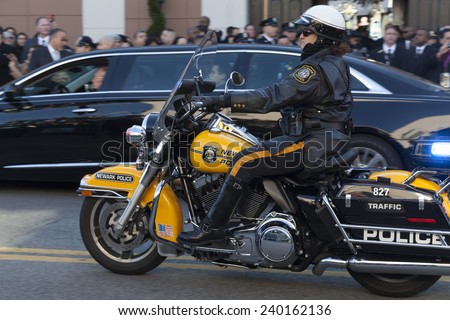 NEW YORK, NY - DECEMBER 27, 2014: Police offiicer on Motorcycle from Newark attends Christ Tabernacle Church for the funeral of slain New York City Police Officer Rafael Ramos