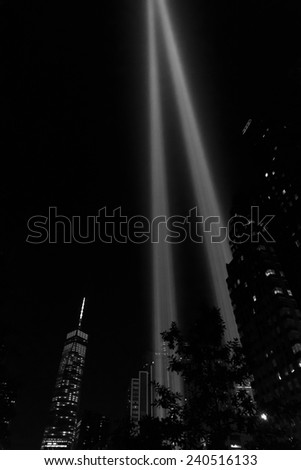 NEW YORK, NY USA - SEPTEMBER 11, 2014: Light tribute to World Trade Center 911 tragedy in downtown Manhattan with Freedom Tower on background