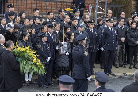Brooklyn, NY - January 04, 2015: Pei Xia Chen widow of Wenjian Liu cries outside Aievoli Funeral Home for the funeral of slain New York City Police Officer Wenjian Liu