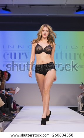 New York, NY - February 23, 2015: Model walks runway at Lingerie Fashion Night for Curvy Couture design as part of Curvexpo New York in Studio 05