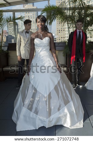 New York, NY - April 18, 2015: Models show off wedding dresses for Malan Breton bridal collection at Empire Hotel Rooftop lounge