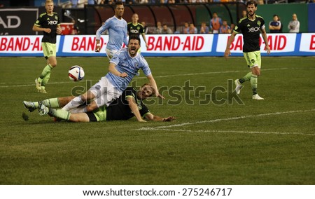 New York, NY - May 3, 2015: David Villa (7) of NYFC figths for ball during MLS game between New York Football Club and Seattle Sounders FC at Yankee Stadium