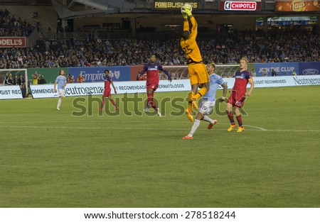 New York, NY - May 15, 2015: Sean Johnson of Chicago Fire (25) saves the ball during the game between New York City Football Club and Chicago Fire FC at Yankee Stadium