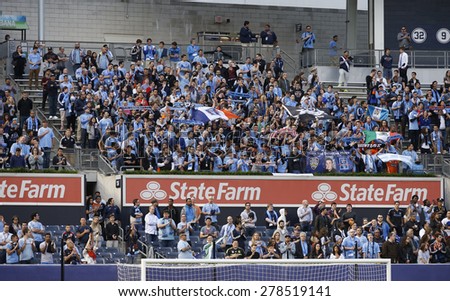 New York, NY - May 15, 2015:  Fans of NYCFC in blue grett the team before game between New York City Football Club and Chicago Fire FC at Yankee Stadium