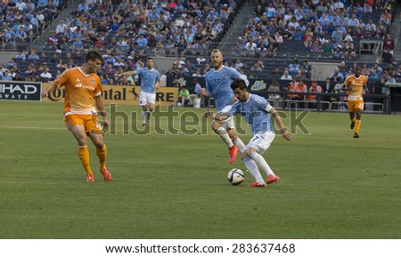 New York, NY - May 30, 2015: David Villa (7) of NYCFC controls ball during the game between New York City Football Club and Houston Dynamo at Yankee Stadium