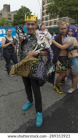 New York, NY USA - June 20, 2015: Designer Anthony Rubio with his dogs attends 33rd Mermaid parade on Coney Island in Brooklyn